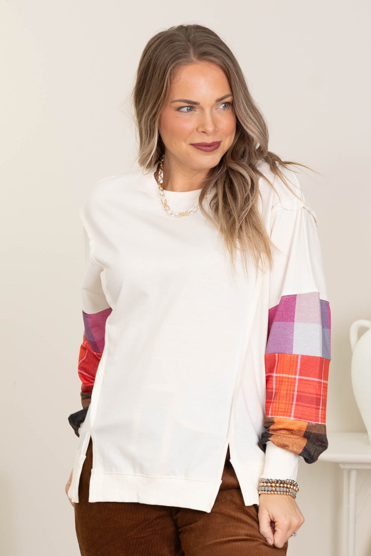 Ivory Top With Slit And Plaid Sleeve Details